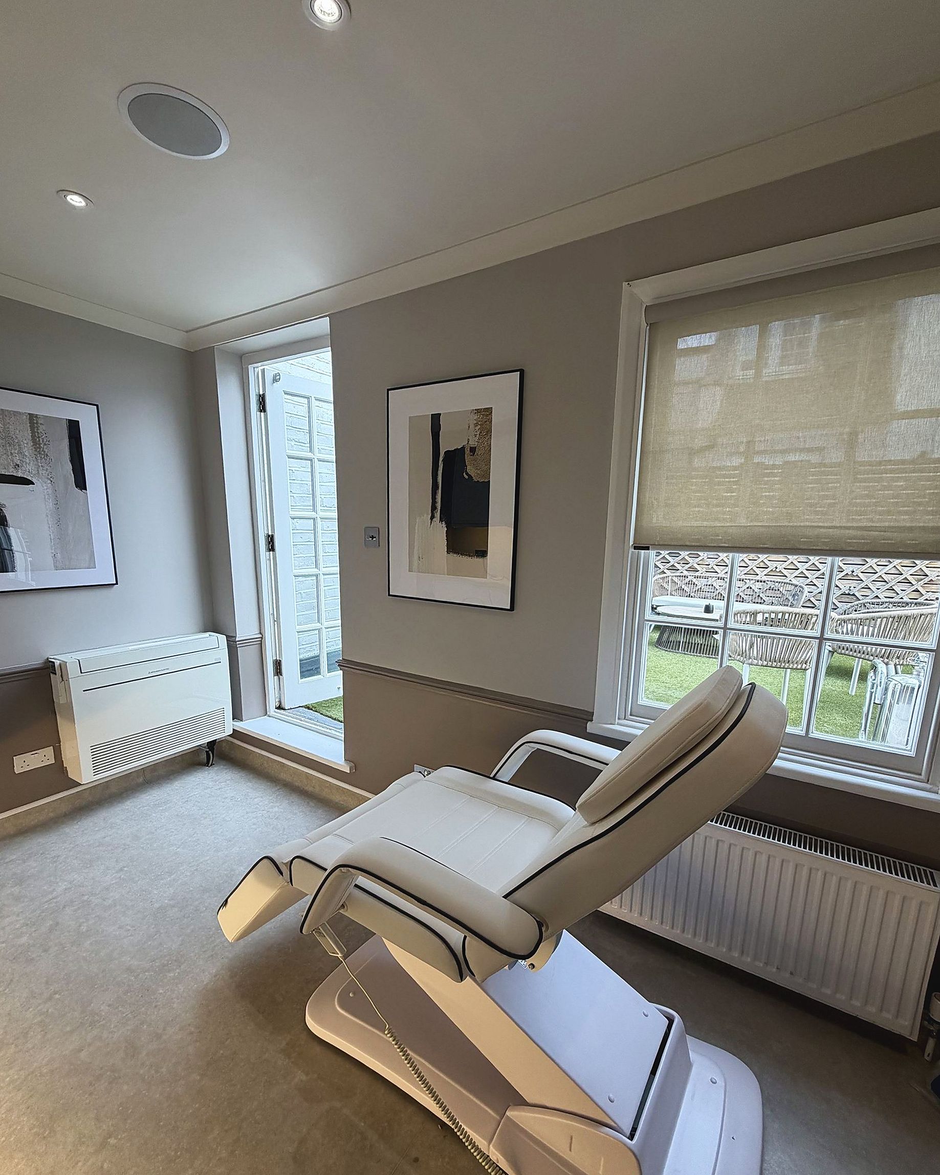 A treatment room at DROM Clinic, with a door onto the roof terrace